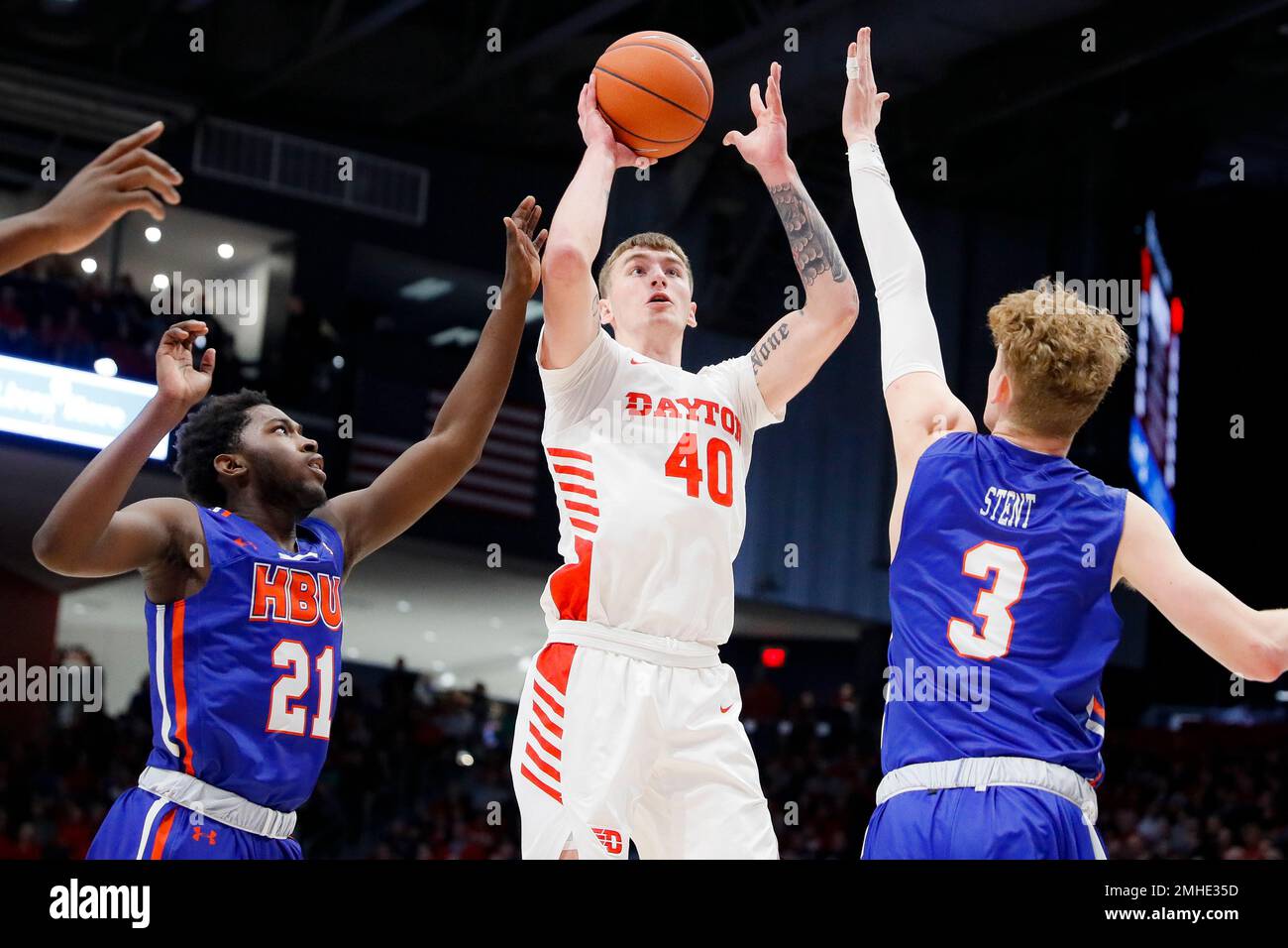 Dayton's Chase Johnson (40) shoots against Houston Baptist's Jackson