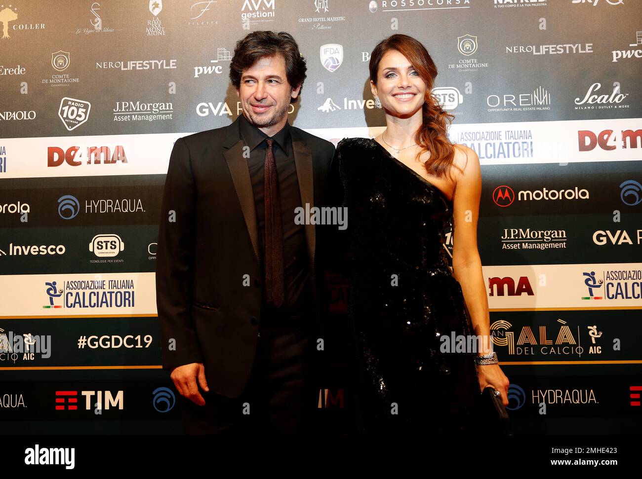 Demetrio Albertini poses with his wife Uriana Capone for photographer ...