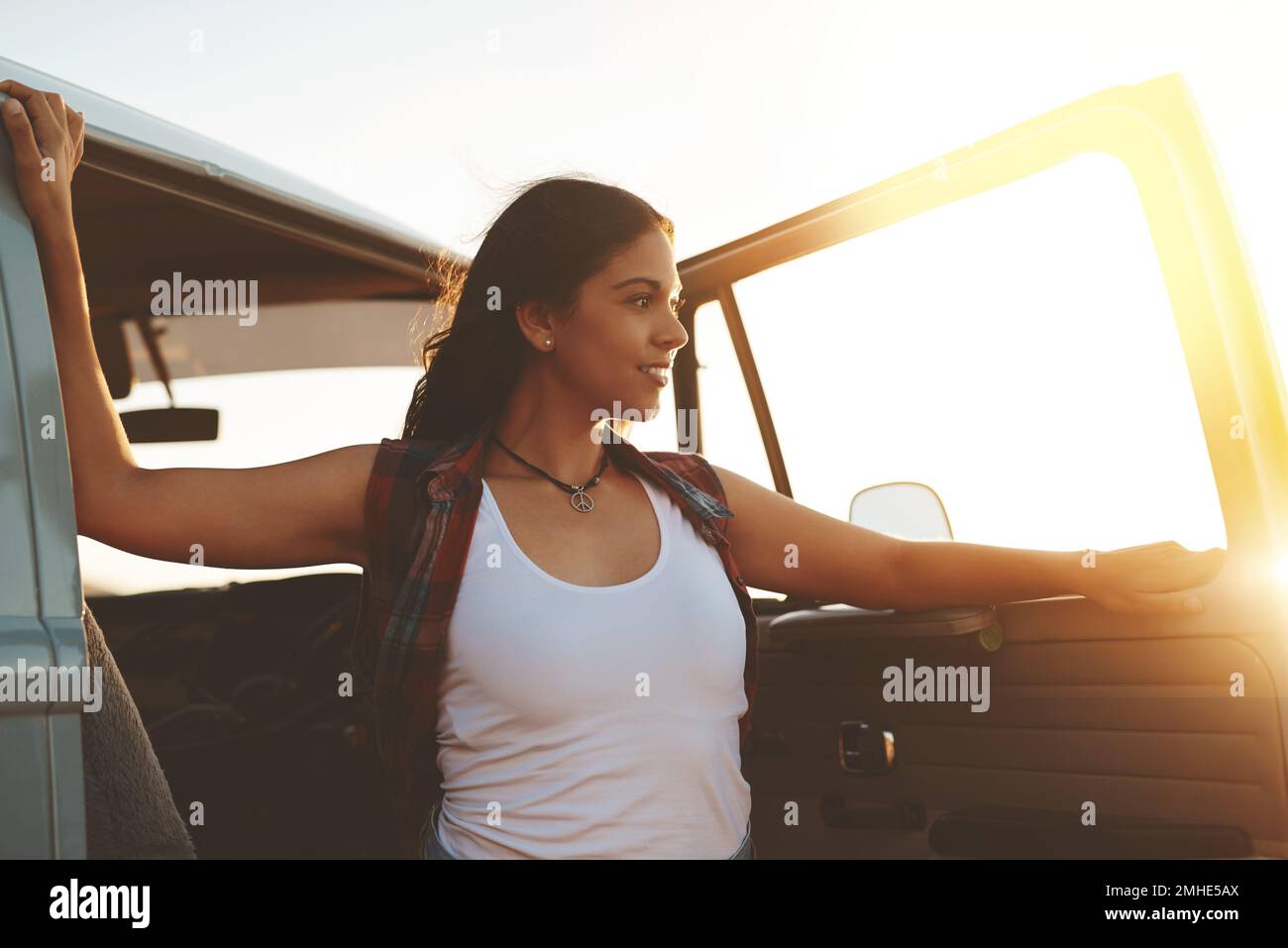 Travel does the mind good. an attractive young woman enjoying a road ...