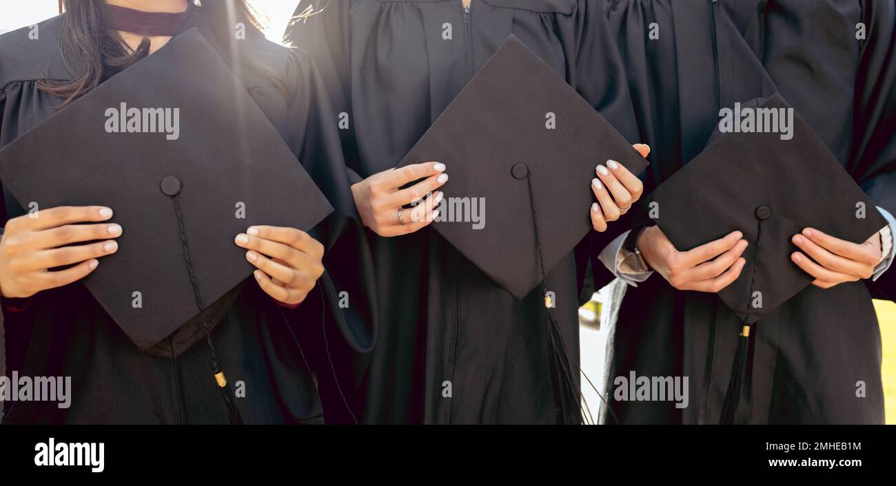 University student group, hands and holding graduation cap together in queue, cropped and success for study goal. Friends, students and graduate Stock Photo