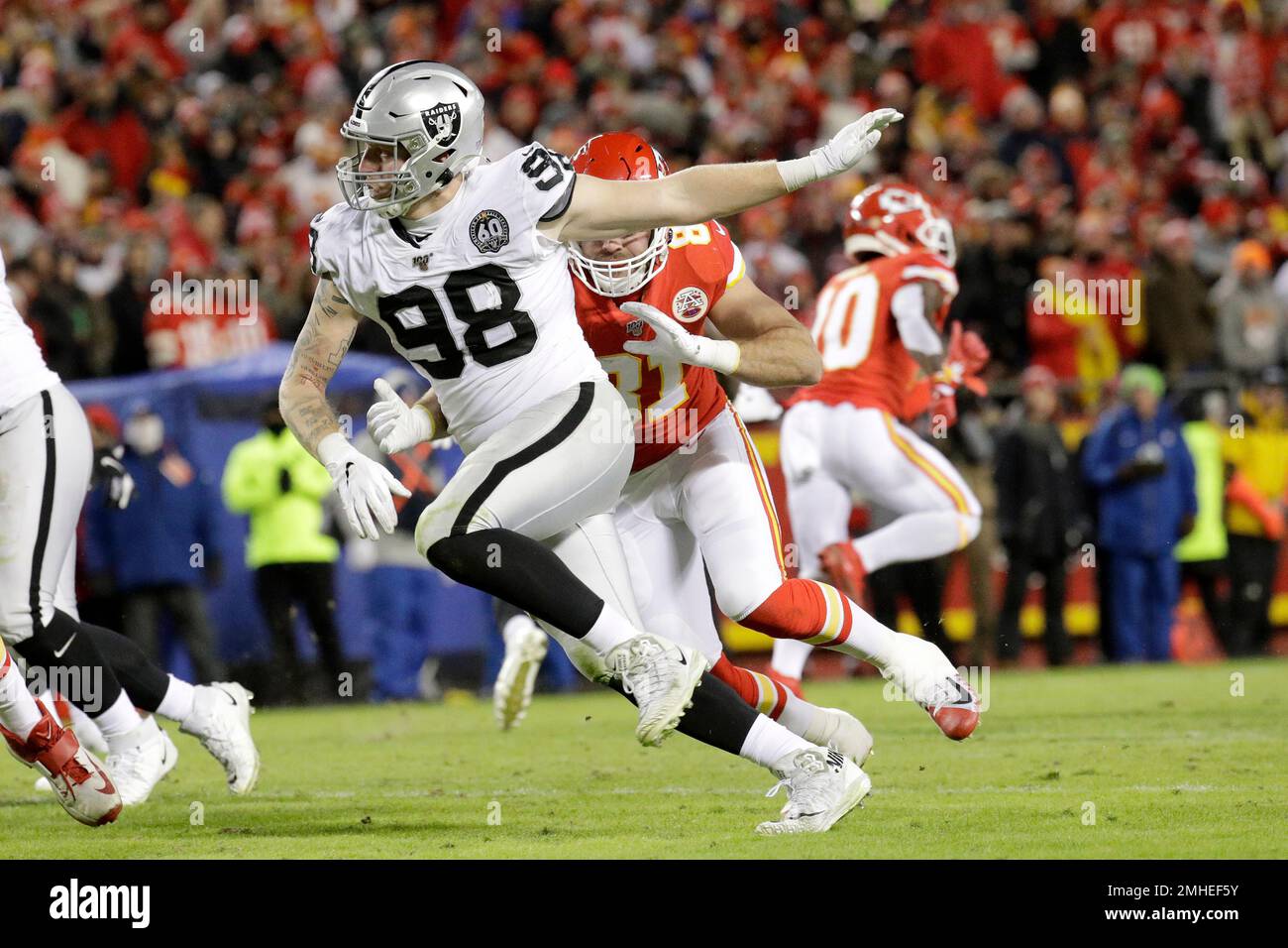 Oakland Raiders defensive end Maxx Crosby (98) gets past Kansas City Chiefs  tight end Blake Bell (81) during the second half of an NFL football game in  Kansas City, Mo., Sunday, Dec.