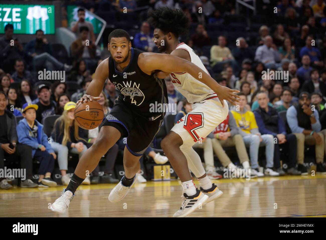Golden State Warriors forward Omari Spellman (4) drives against Chicago