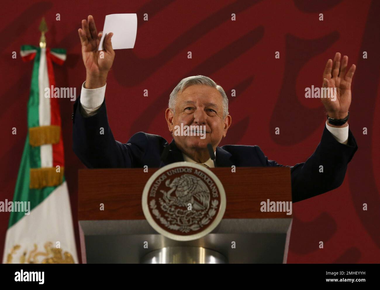 Mexican President Andres Manuel Lopez Obrador greets journalist