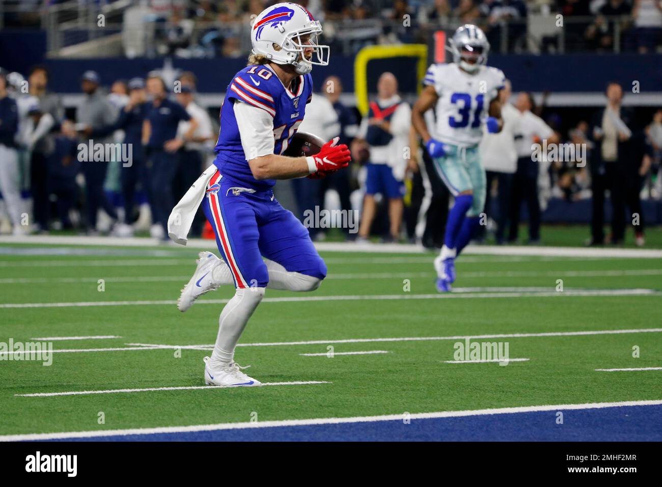 Buffalo Bills wide receiver Cole Beasley (10) reaches the end zone for a  touchdown after catching a pass as Dallas Cowboys cornerback Byron Jones  (31) looks on in the first half of