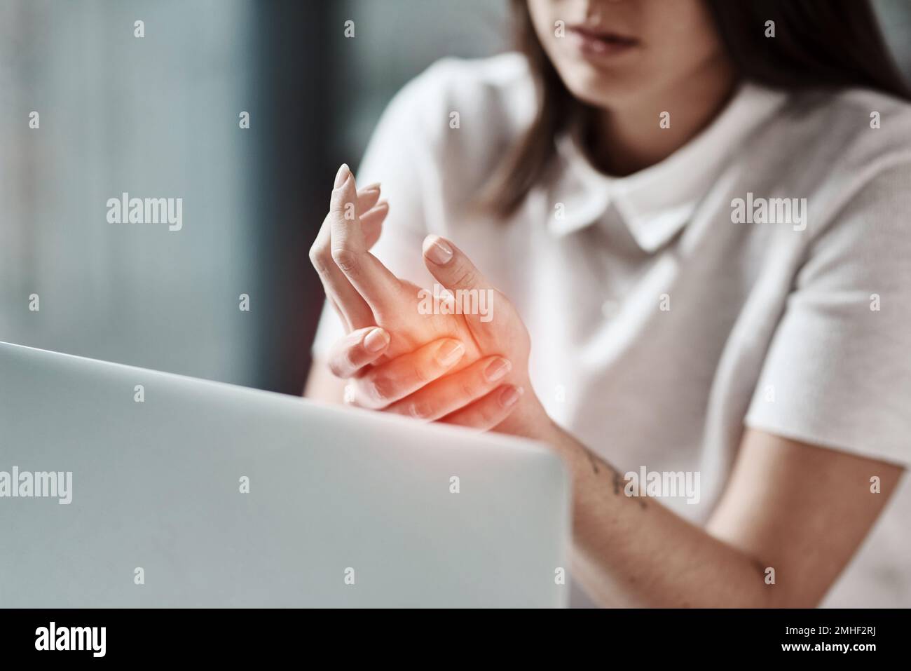 Laptop, pain in hand and woman in office with wrist injury from writing