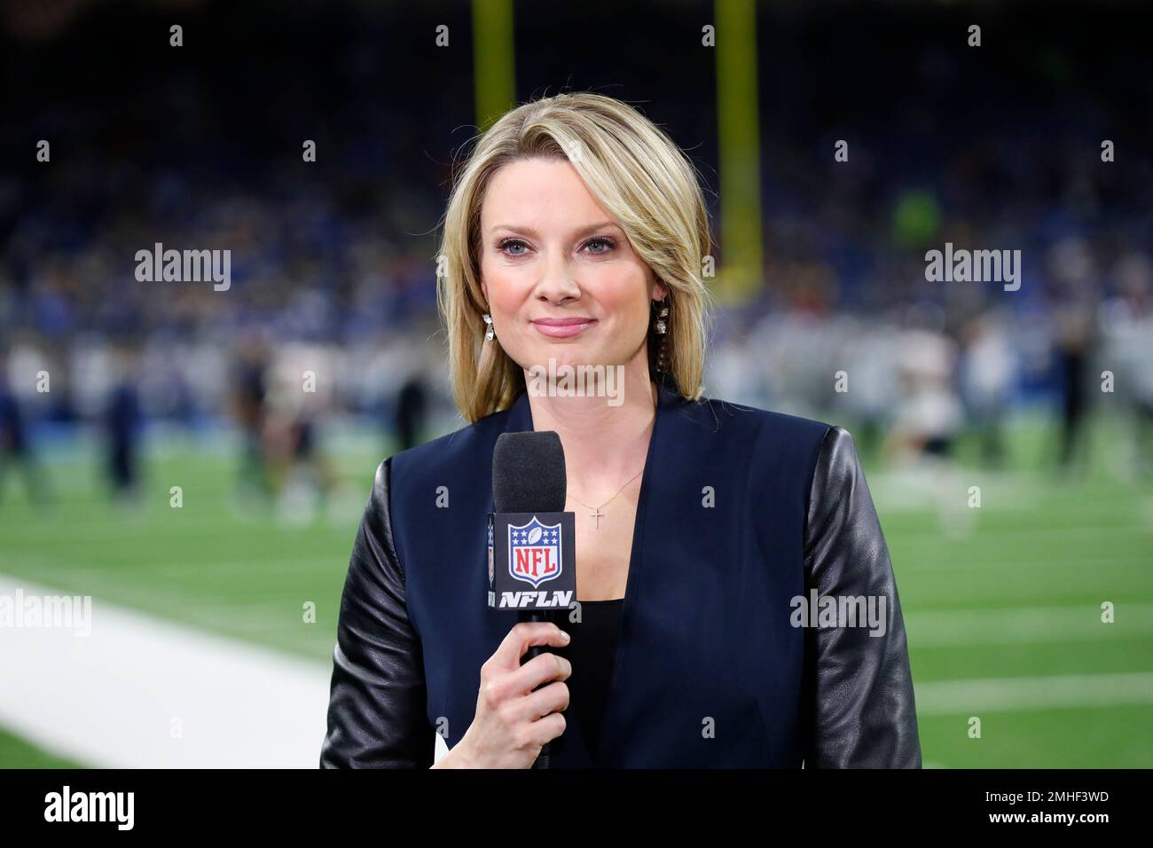 NFL Network reporter Stacey Dales, left, talks with Green Bay Packers  President and CEO Mark Murphy on the sideline before an NFL football game  against the New Orleans Saints, Sunday, Sept. 12