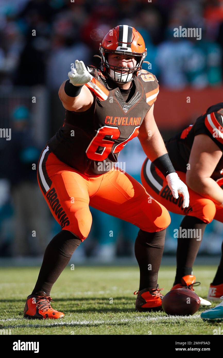 Cleveland Browns center JC Tretter (64) looks over the Miami Dolphins  defense during an NFL football