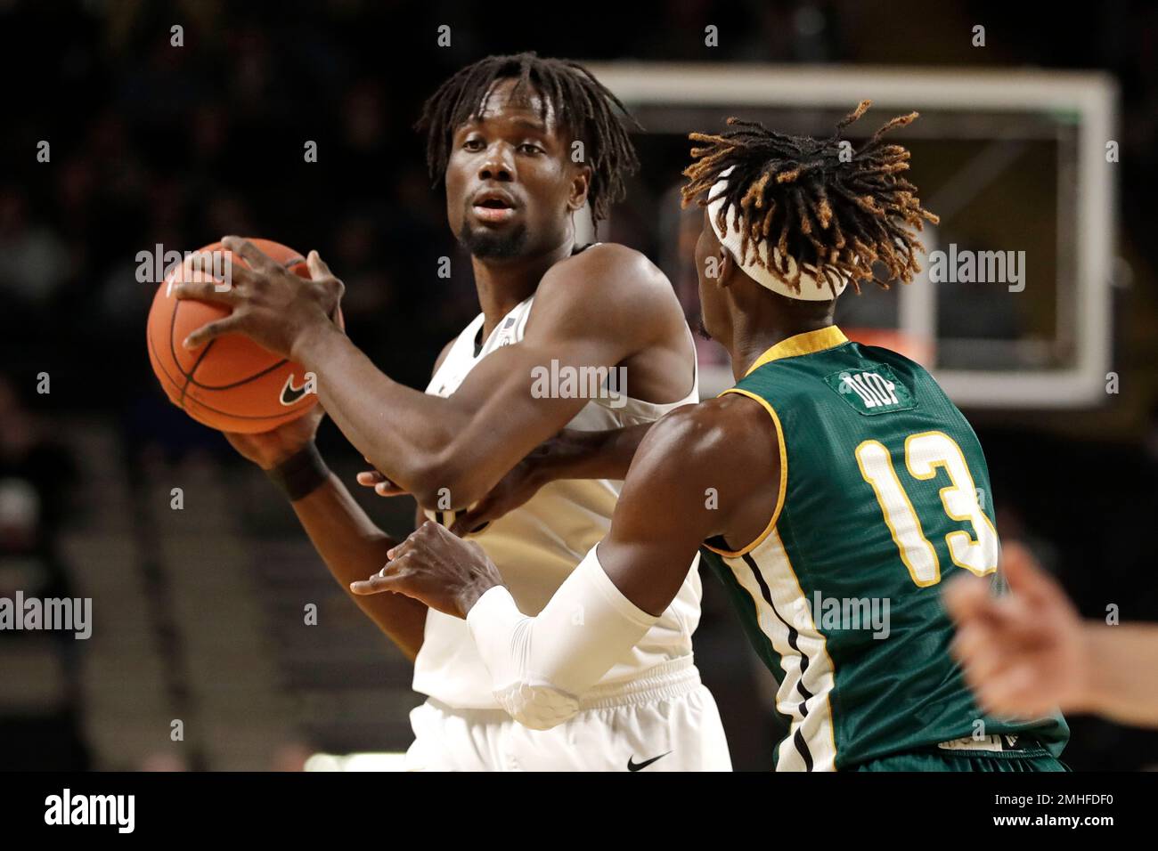 Vanderbilt forward Ejike Obinna, left, is defended by Southeastern