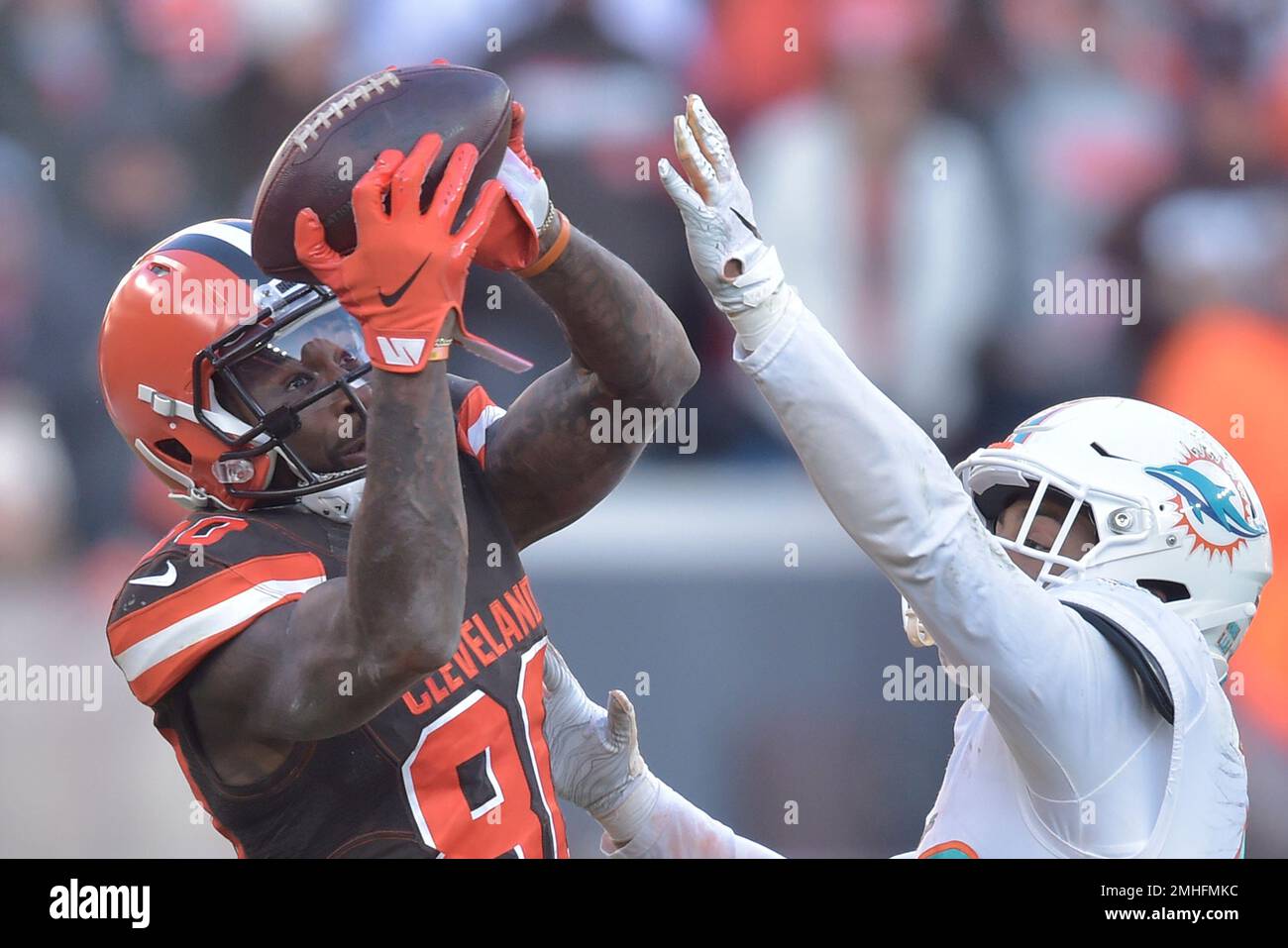 Cleveland Browns wide receiver Jarvis Landry (80) makes a catch beside  Miami Dolphins defensive back Nik Needham (40) in the fourth quarter of an  NFL football game, Sunday, Nov. 24, 2019, in