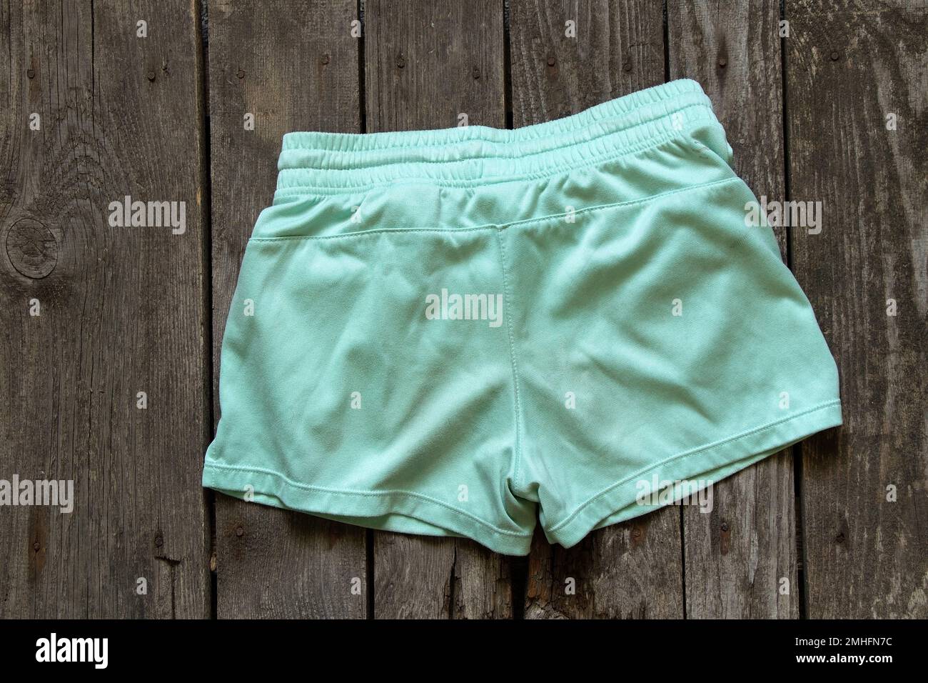 womens shorts lay on rustic brown background, womens clothing, fashion Stock Photo