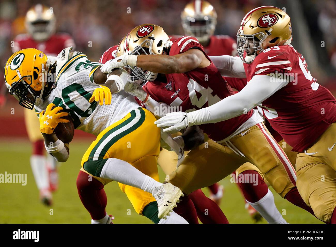 Green Bay, Wisconsin, USA. 22nd Jan, 2022. San Francisco 49ers middle  linebacker Fred Warner (54) tackles Green Bay Packers running back Aaron  Jones (33) during the NFL divisional playoff football game between