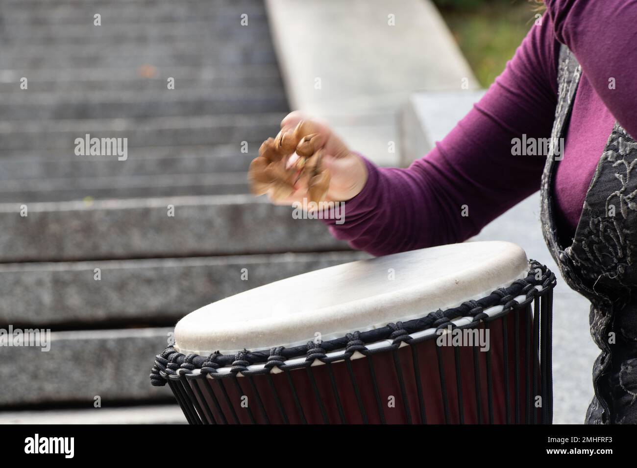 playing the drum with hands closeup, musical instrument Stock Photo