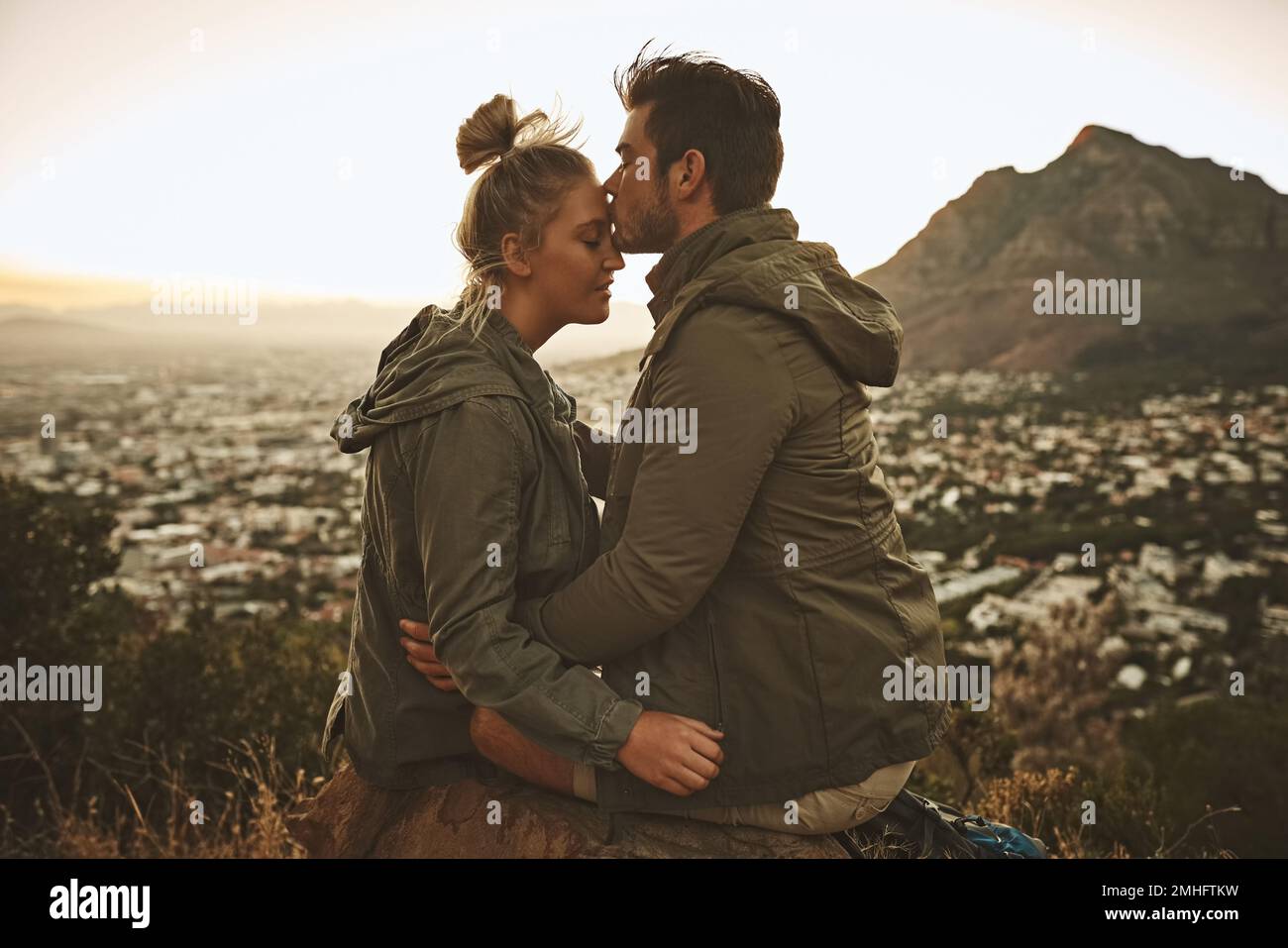 The best gift you can give is an adventure. an affectionate couple on a mountain top. Stock Photo