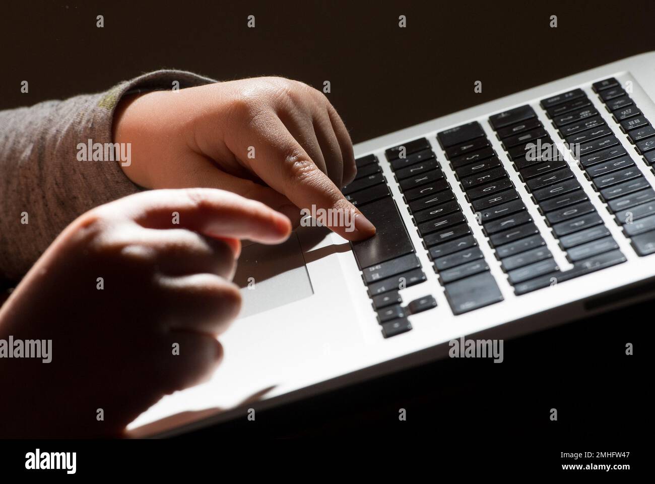 File photo dated 26/05/22 of a child using a laptop computer. There has been a 1,000% increase in webpages showing self-generated sexual abuse imagery of primary school children since 2019, safety group The Internet Watch Foundation has said. Stock Photo