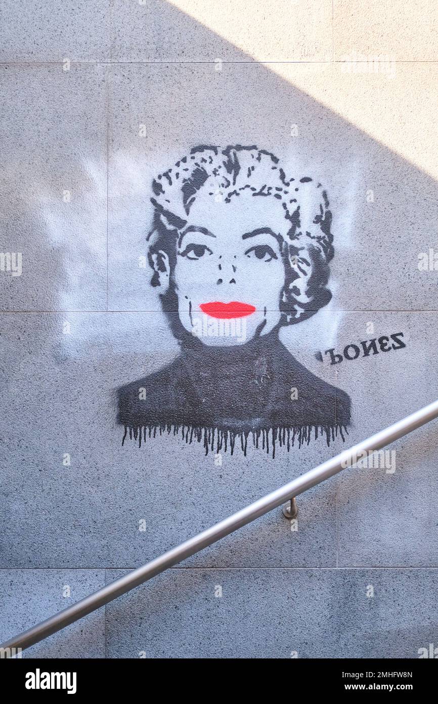 A painted stencil of Michael Jackson as Andy Warhol's Marilyn Monroe painting. With bright red lips. At the station entrance to the Metro stop, Munici Stock Photo