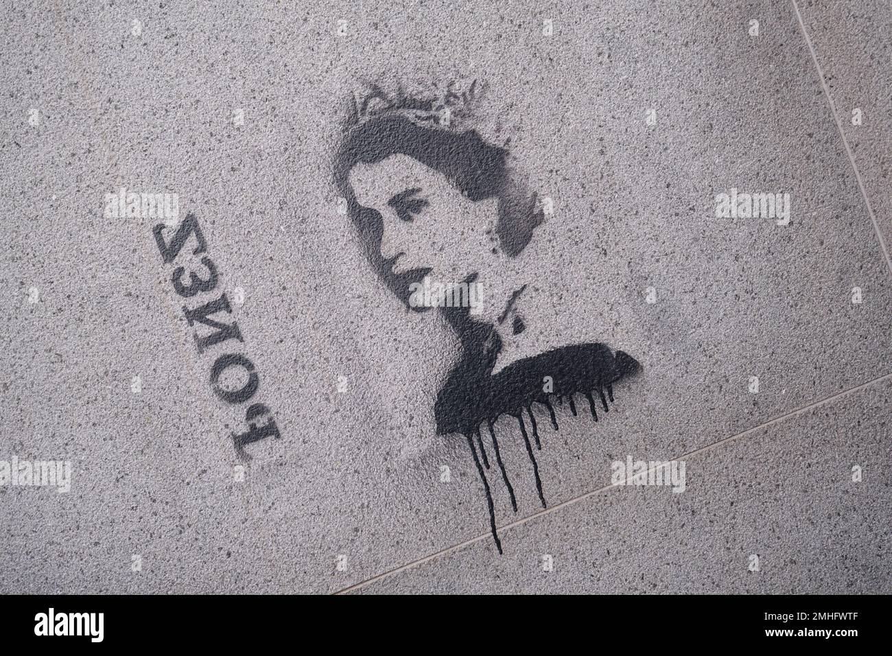 A painted stencil by the artist Bones of Queen Elizabeth II. At a Metro station entrance. An example of graffiti in Naples, Napoli, Italy, Italia. Stock Photo