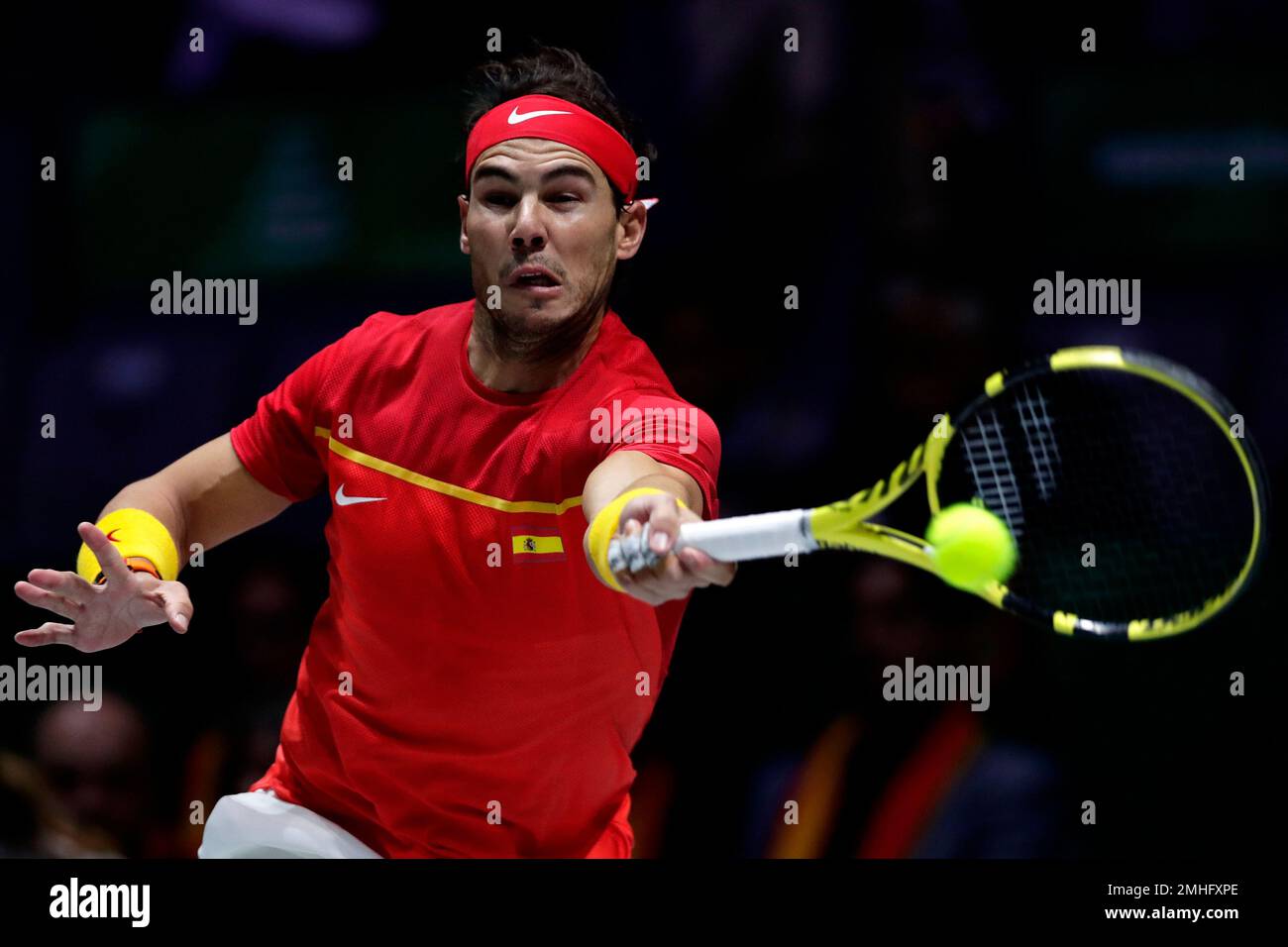 Spains Rafael Nadal hits a forehand to Canadas Denis Shapovalov during their tennis singles match of the Davis Cup final in Madrid, Spain, Sunday, Nov
