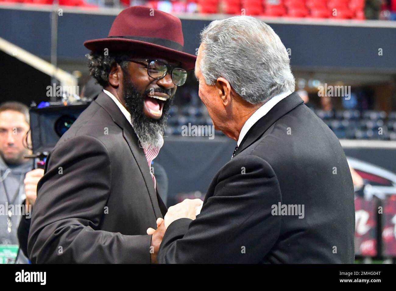 Former NFL player Ed Reed Jr. speaks with Atlanta Falcons owner Arthur ...