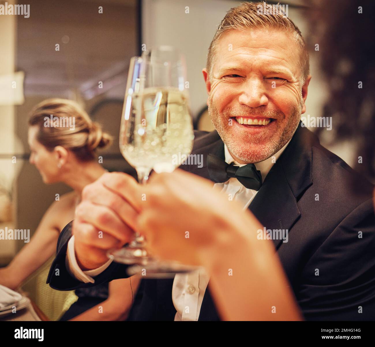 Champagne, cheers celebrate and party with man in suit, smile on face at formal luxury event. Success, bubbly wine and happy people celebration of Stock Photo