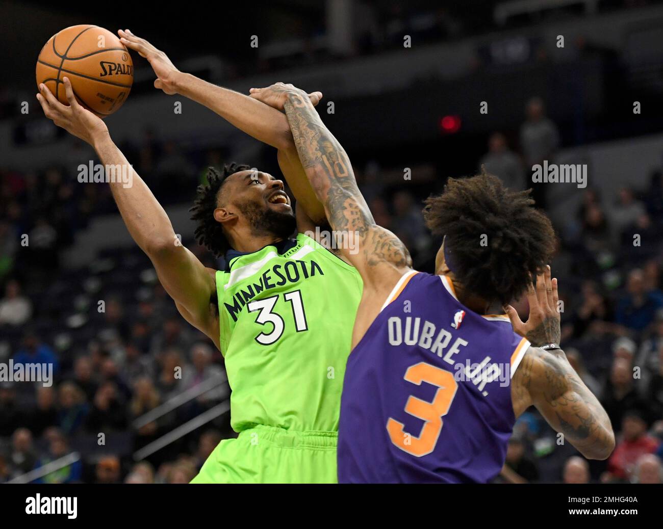 Phoenix Suns' Kelly Oubre Jr. (3) fouls Minnesota Timberwolves' Keita ...