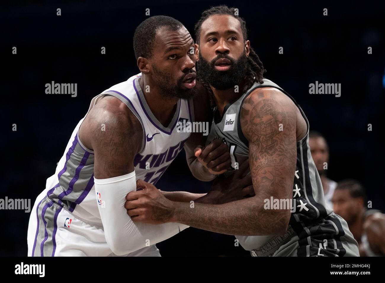 Sacramento Kings center Dewayne Dedmon, left, and Brooklyn Nets center