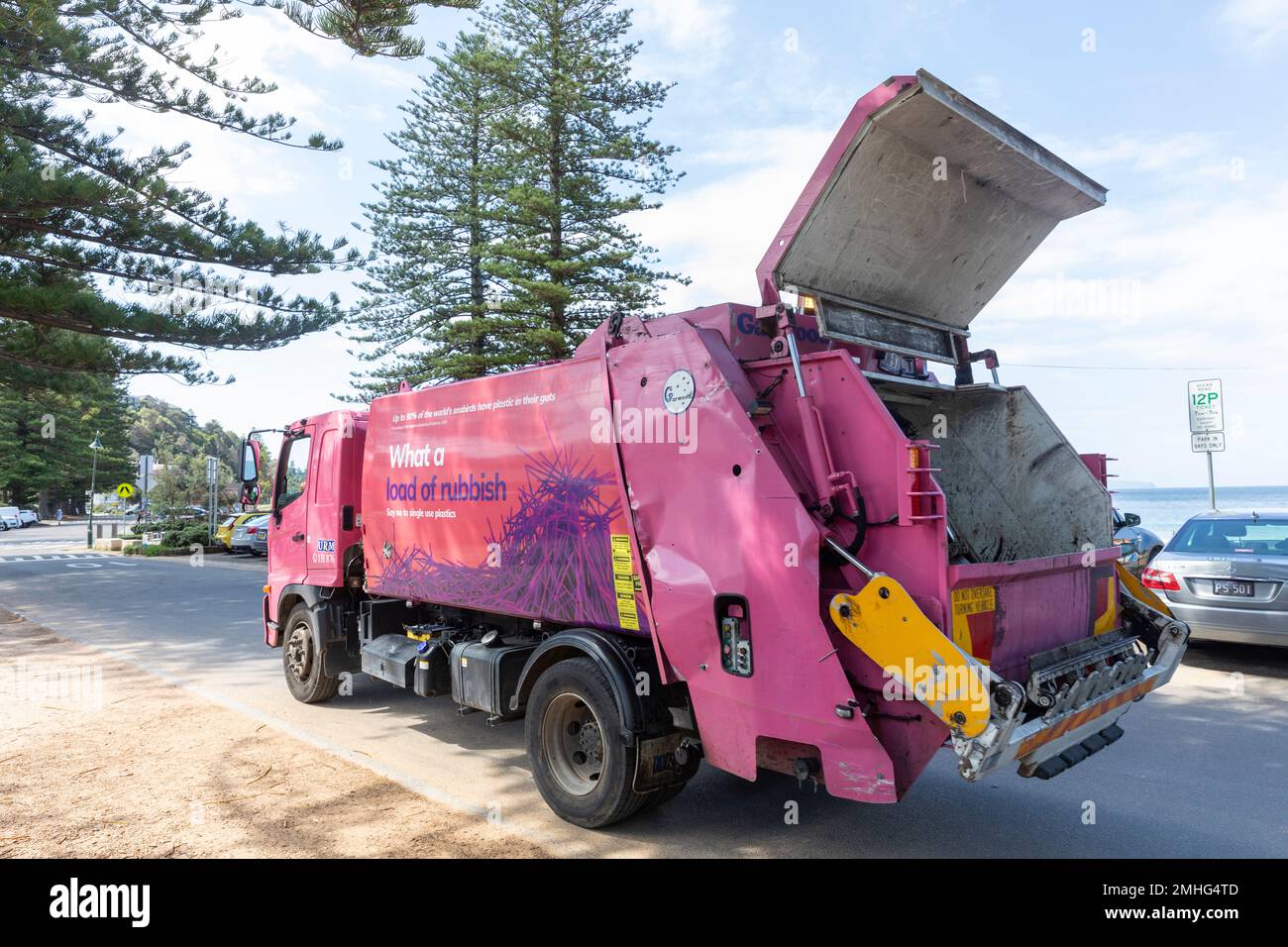 Garbage rubbish collection truck at Palm Beach Sydney collecting waste