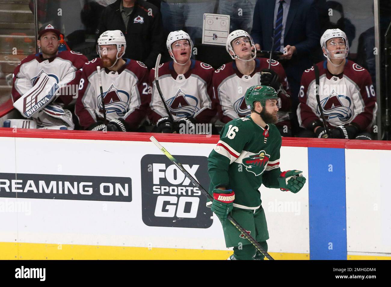 Colorado Avalanche players watch the replay as Minnesota Wilds Jason Zucker skates by after his go-ahead and game-winning goal off Colorado Avalanches goalie Philipp Grubauer of Germany in the third period of