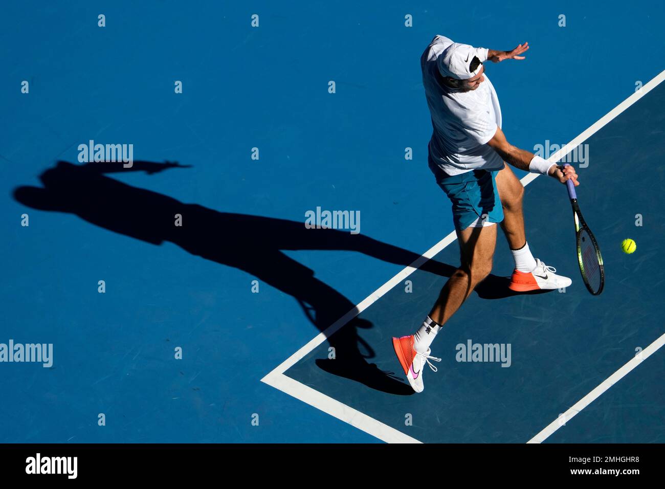 Karen Khachanov of Russia plays a forehand return to Stefanos Tsitsipas of Greece during their semifinal match at the Australian Open tennis championship in Melbourne, Australia, Friday, Jan