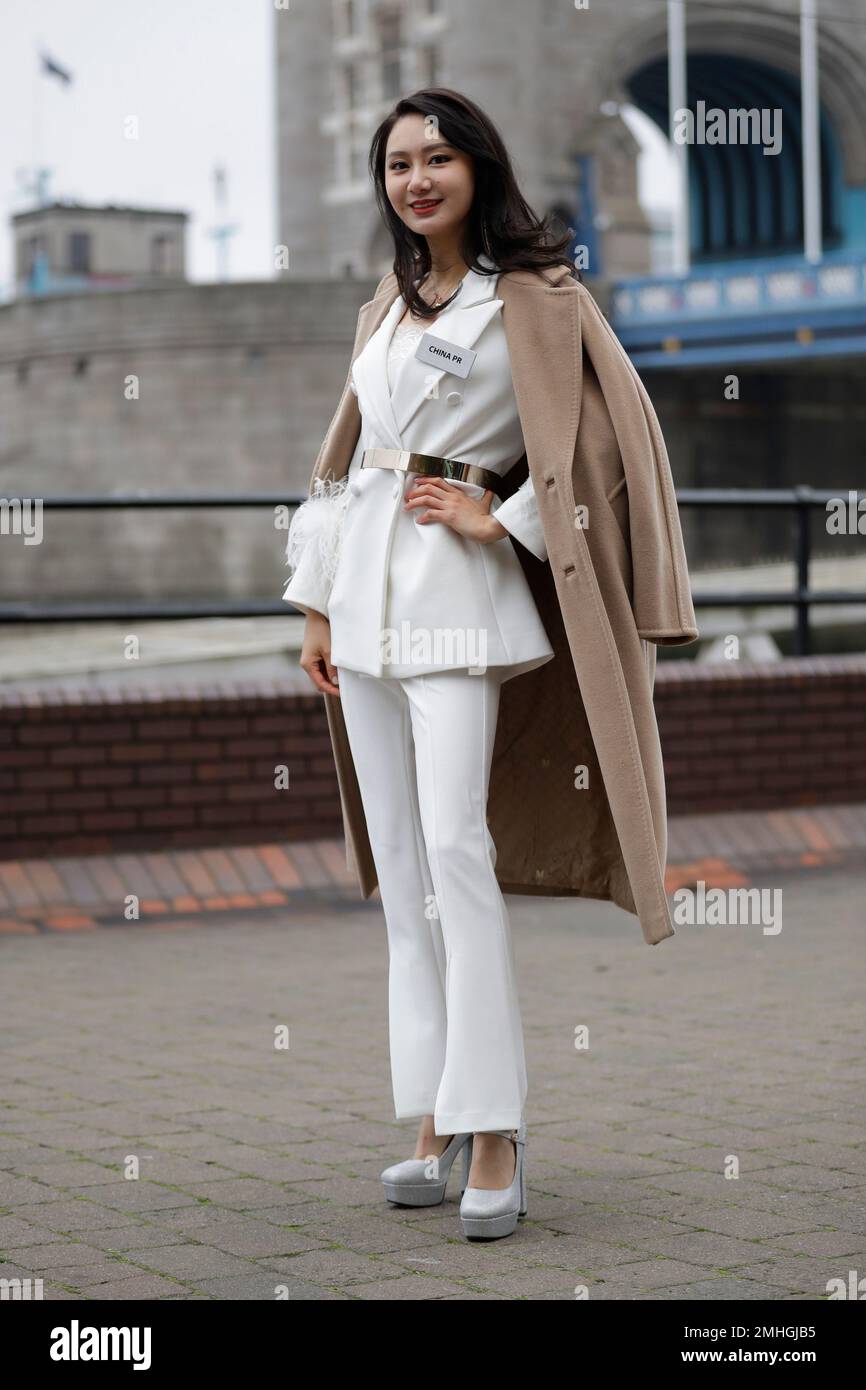 The China Miss World contestant Li Peishan poses for photographs ...