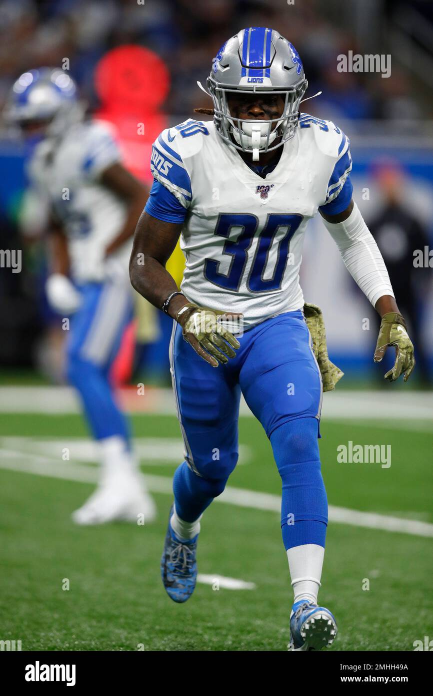 Detroit Lions defensive back Dee Virgin (30) steps on the line for