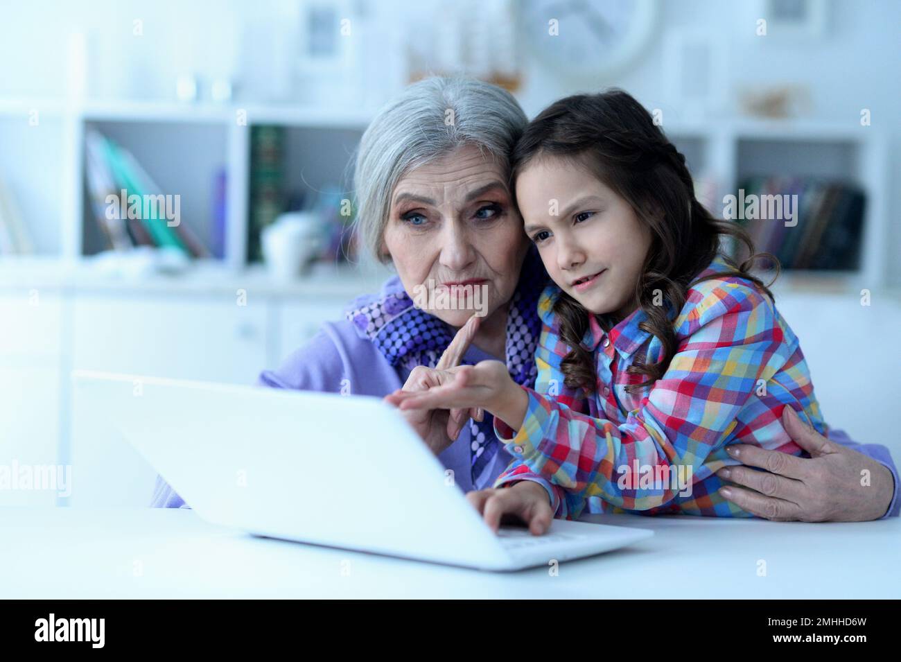 portrait of grandmother and daughter using laptop Stock Photo - Alamy