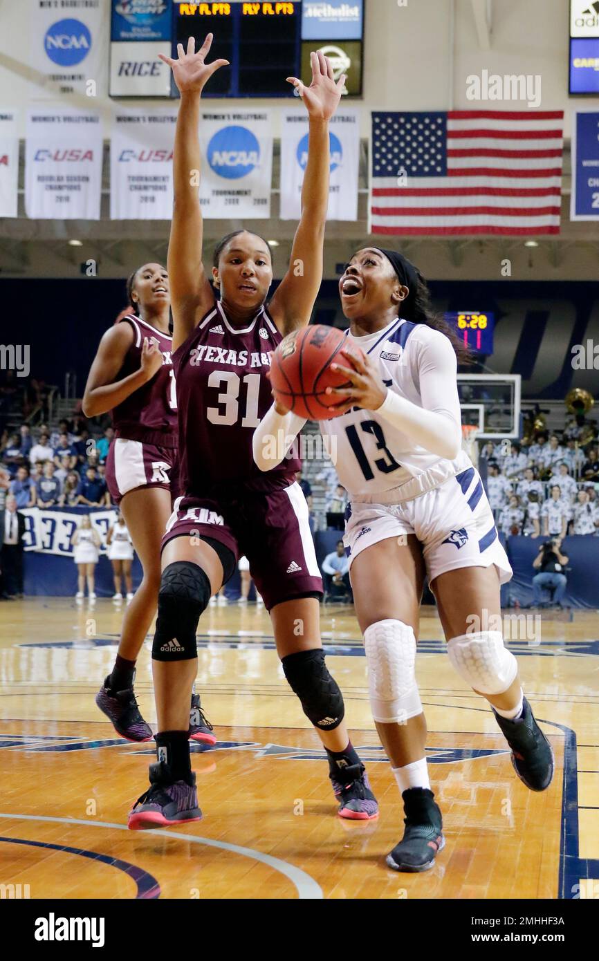 Rice guard Erica Ogwumike (13) drives to shoot past Texas A&M forward N