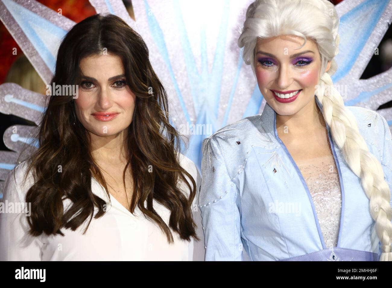 Voice actress Idina Menzel, left, poses for photographers alongside the ...