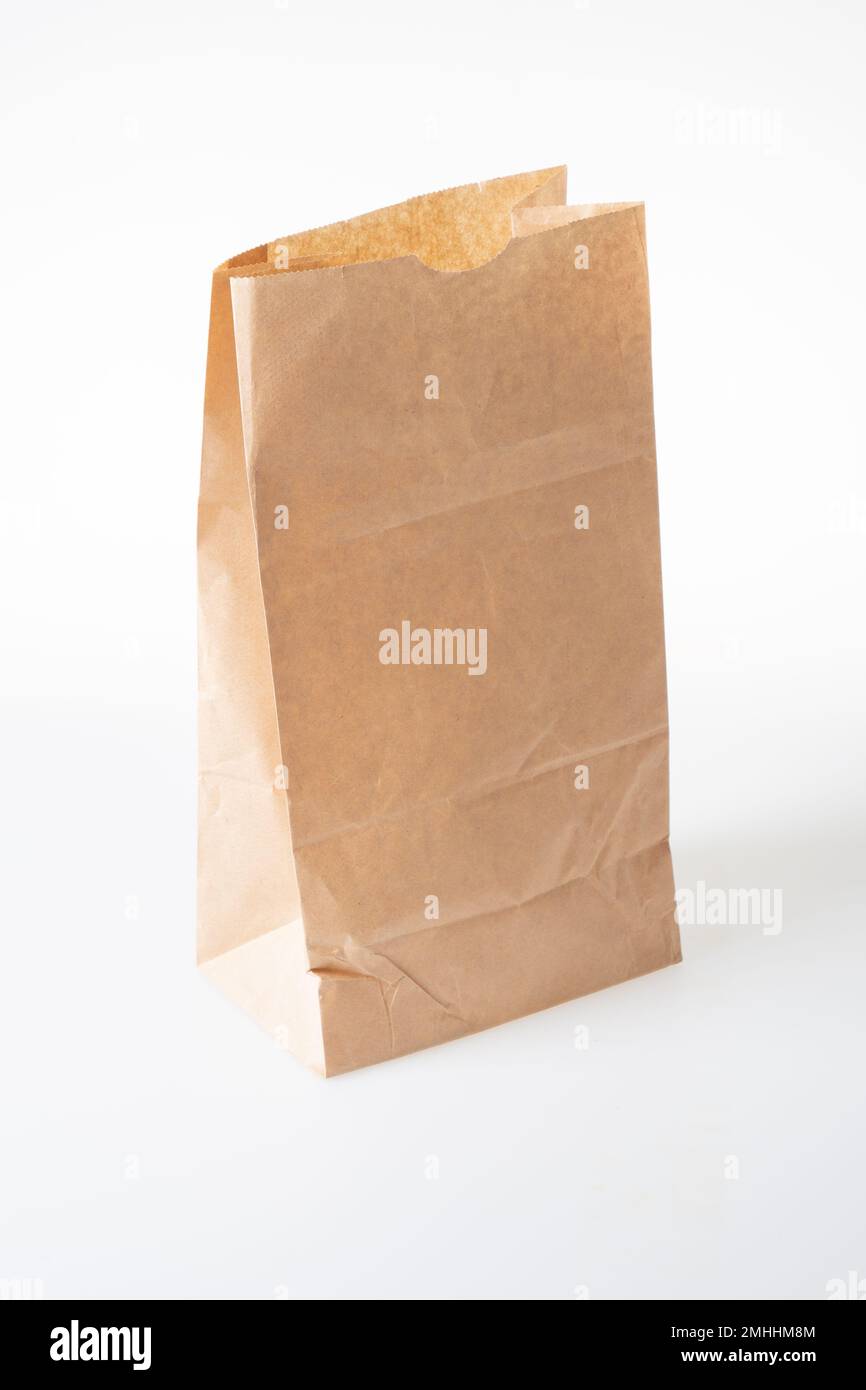 blank brown paper bag on white background Stock Photo - Alamy