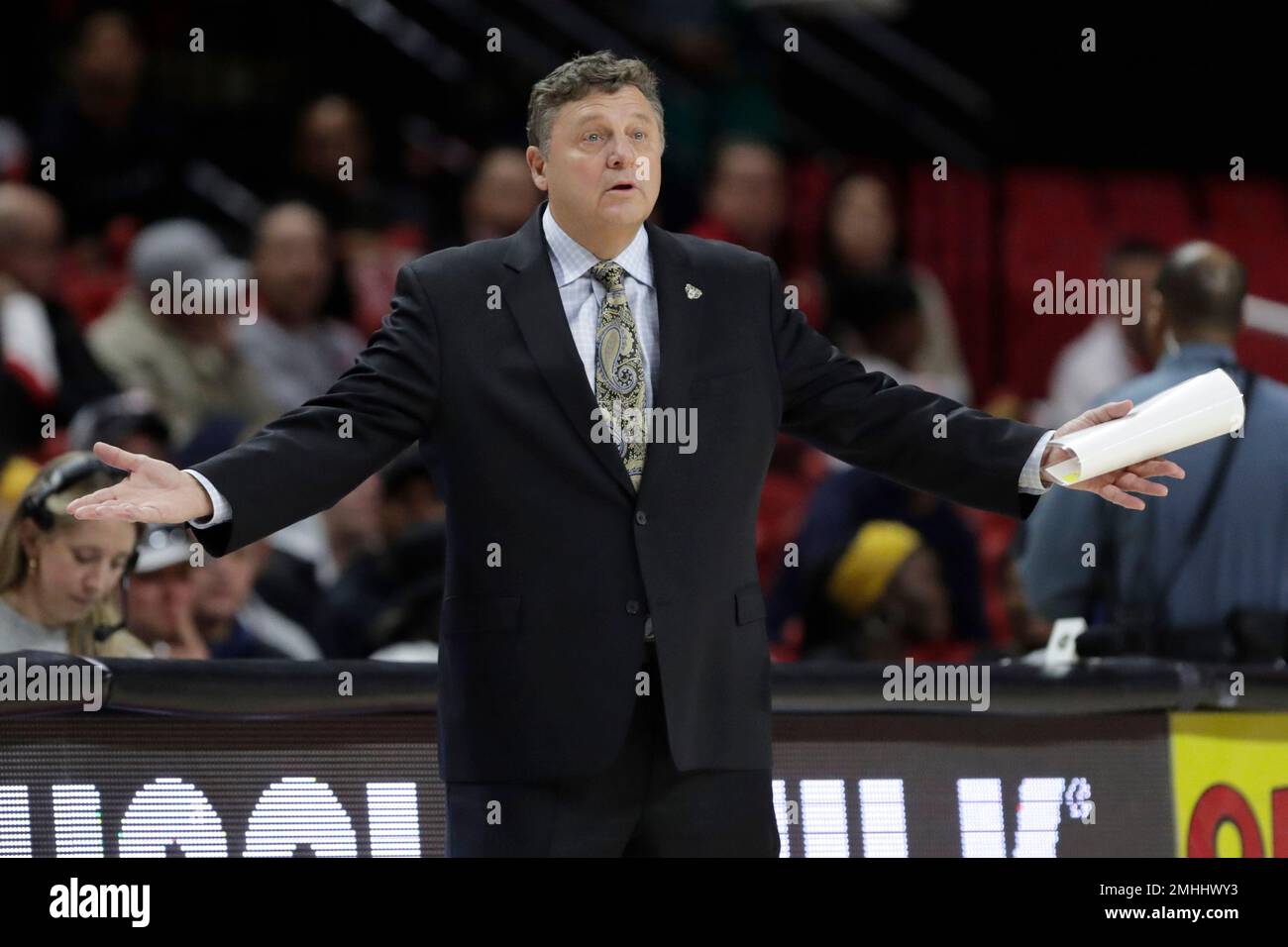 Oakland head coach Greg Kampe reacts during the first half of an NCAA ...