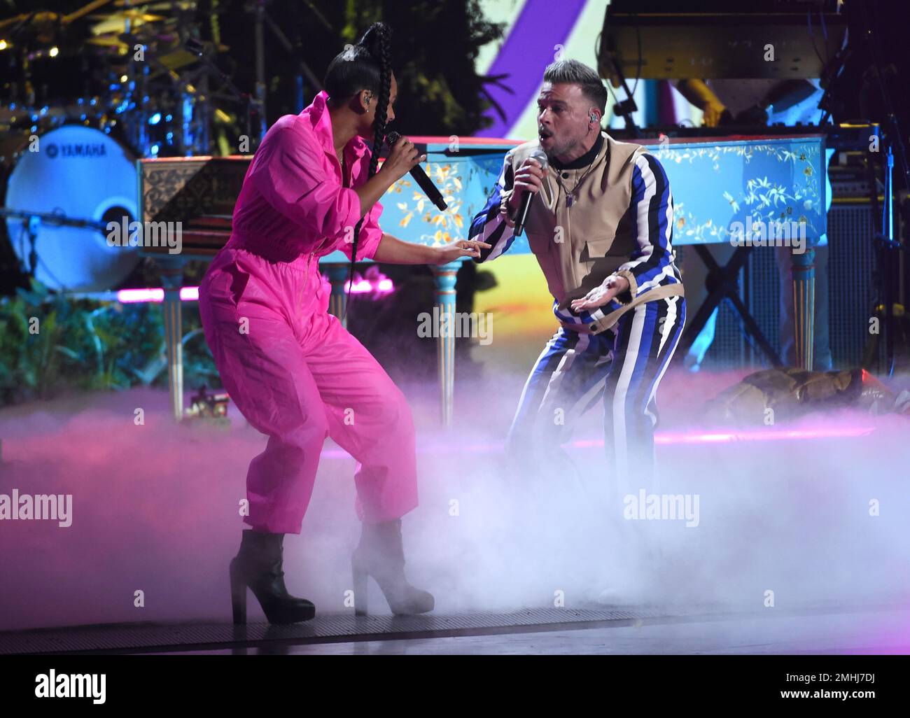 Alicia Keys, left, and Pedro Capo perform a medley at the 20th Latin