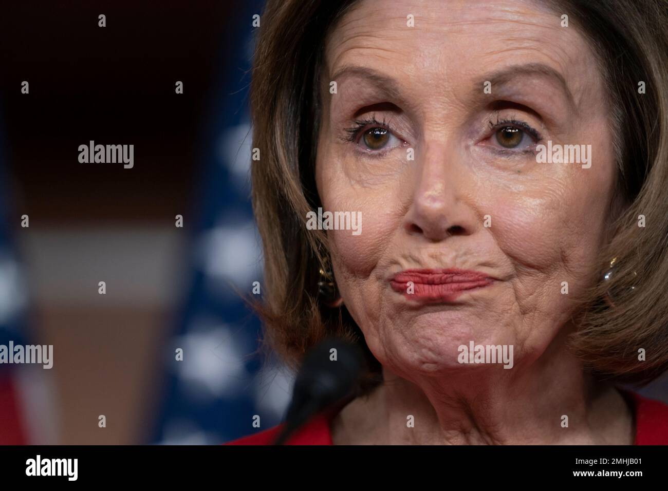 Speaker of the House Nancy Pelosi, D-Calif., talks to reporters on the morning after the first public hearing in the impeachment probe of President Donald Trump on his effort to tie U.S. aid for Ukraine to investigations of his political opponents, on Capitol Hill in Washington, Thursday, Nov. 14, 2019. Pelosi says the president's actions in the impeachment inquiry amount to "bribery." (AP Photo/J. Scott Applewhite) Stock Photo