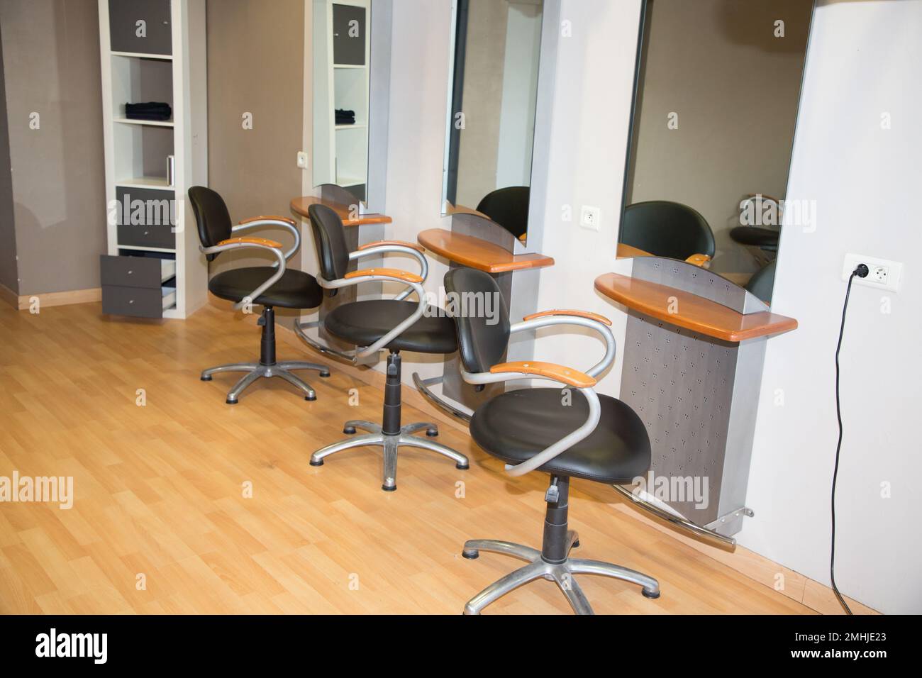chairs and mirrors in modern hairdressing Stock Photo Alamy