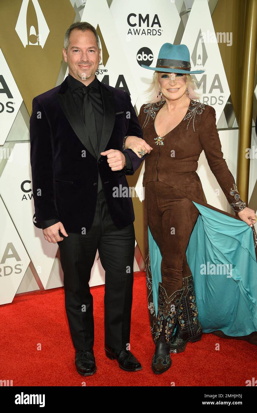 Buddy Quaid, left, and Tanya Tucker arrive at the 53rd annual CMA