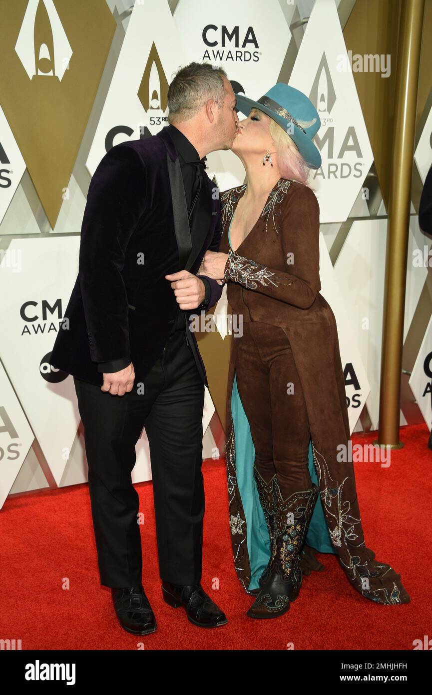 Buddy Quaid, left, and Tanya Tucker arrive at the 53rd annual CMA