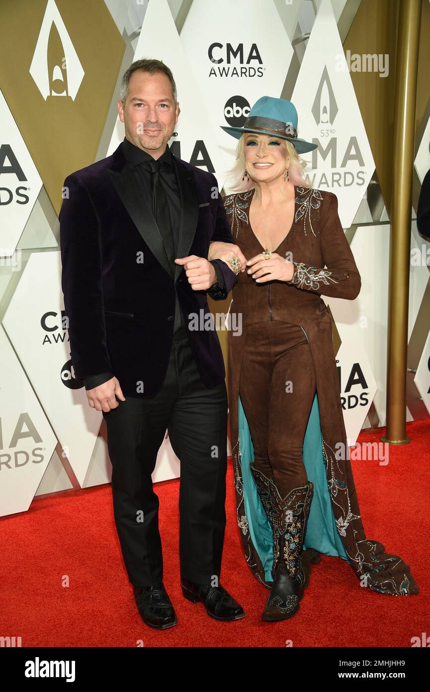 Buddy Quaid, left, and Tanya Tucker arrive at the 53rd annual CMA