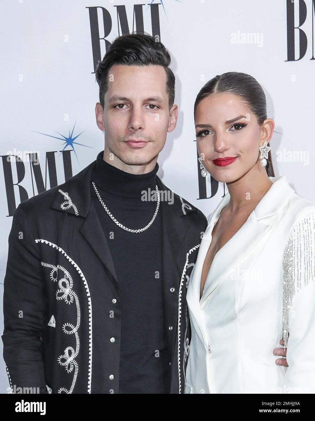 Devin Dawson, left, and his wife Leah Sykes, arrive at 67th Annual BMI