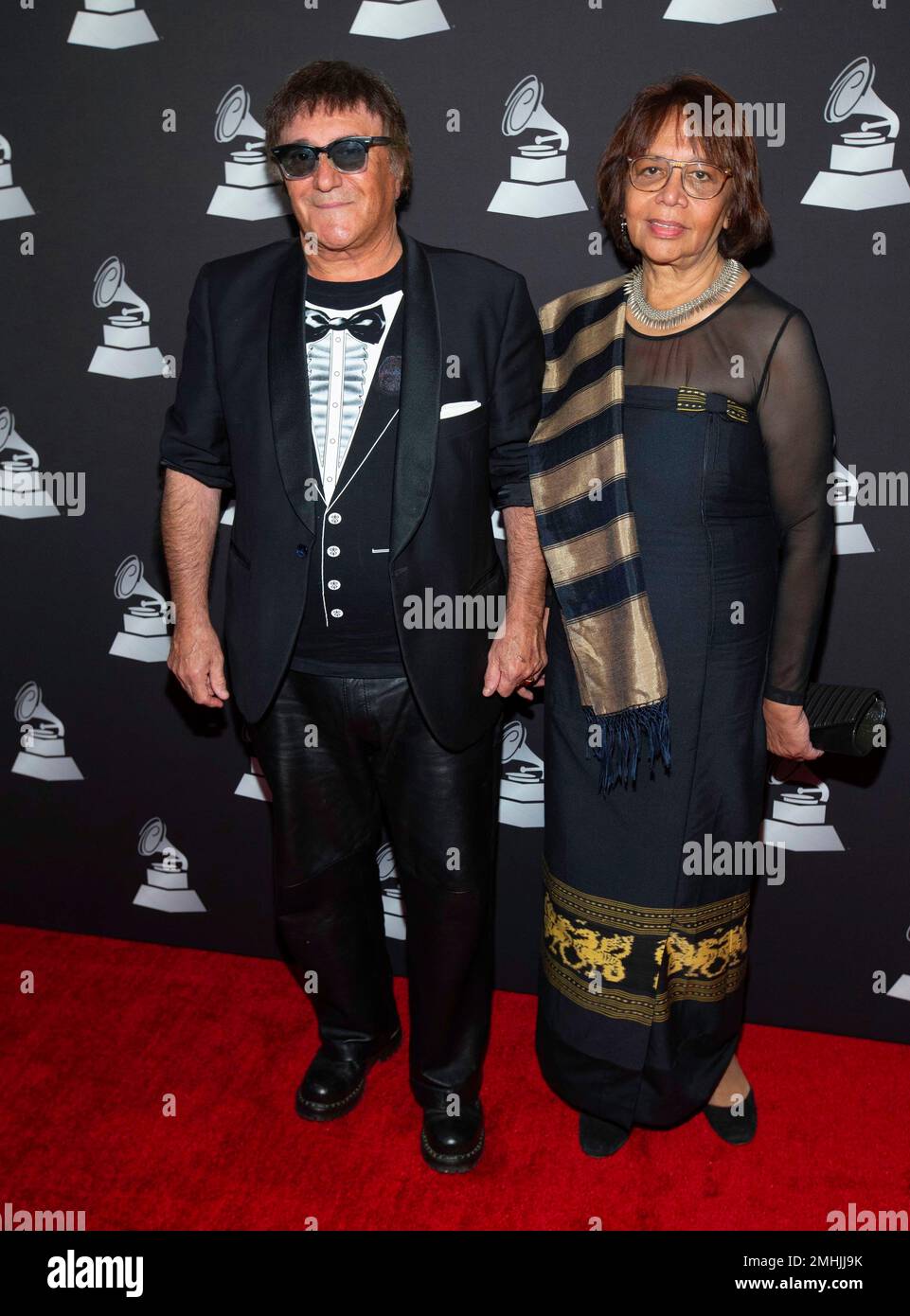 José Cid along with his Gabriela Carrascalao-Cid, arrive at the Latin Grammy special merit awards at the Waldorf Astoria Hotel, Wednesday, Nov. 13, 2019, in Las Vegas. (Photo by Eric Jamison/Invision/AP) Stock Photo