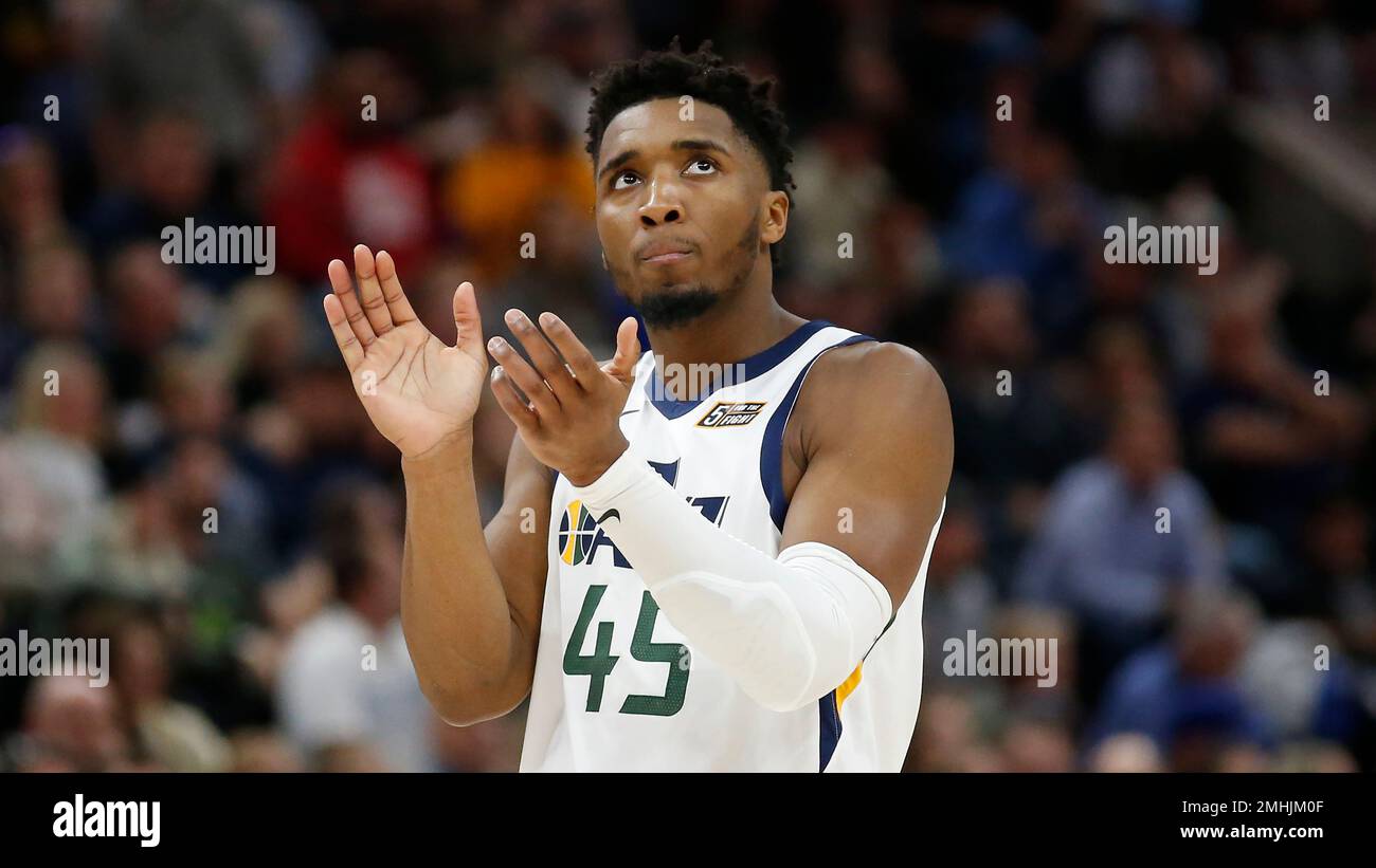 Utah Jazz guard Donovan Mitchell (45) claps for his team in the second ...