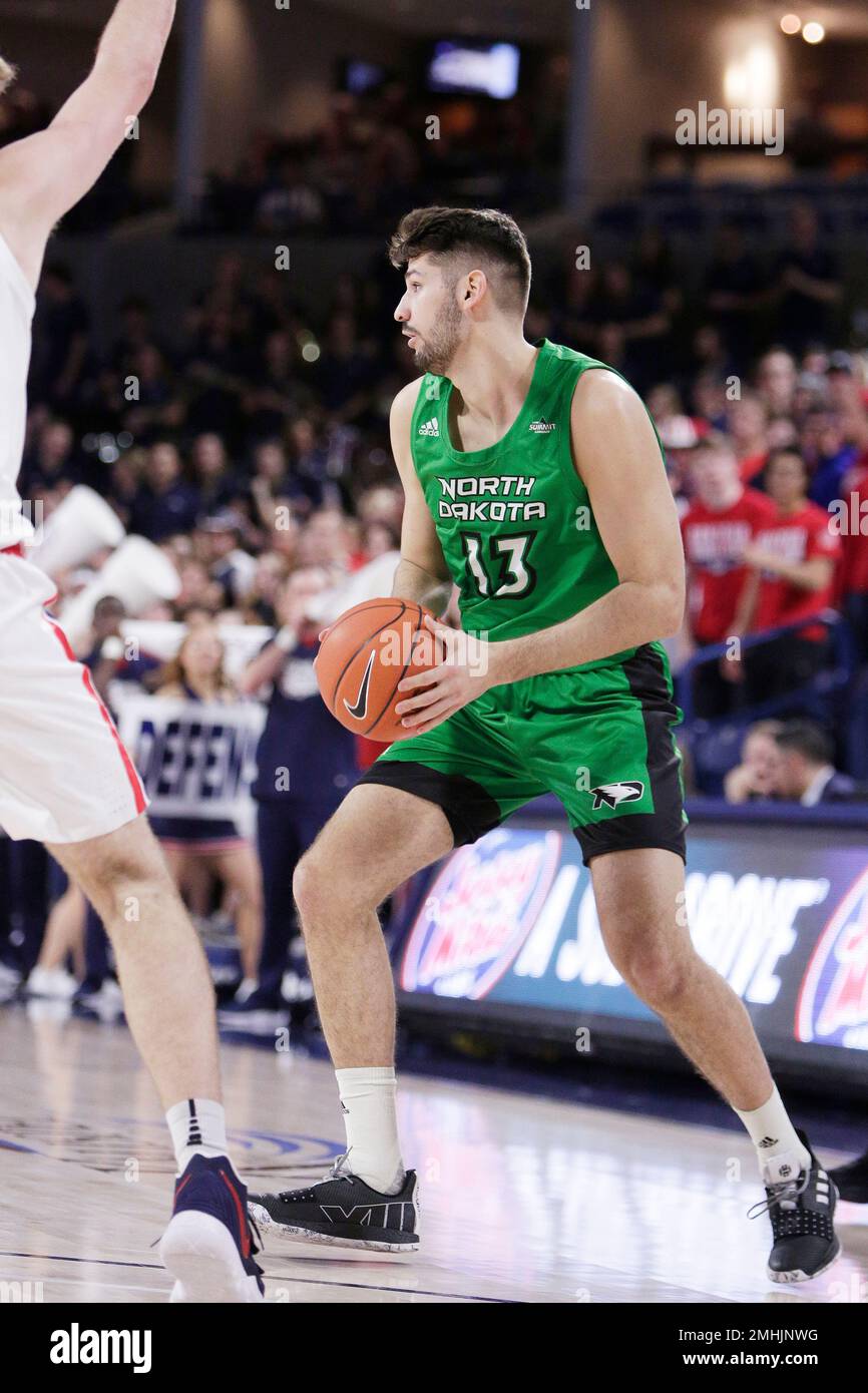 North Dakota forward Marko Coudreau (13) looks to pass during the first  half of an NCAA college basketball game against Gonzaga in Spokane, Wash.,  Tuesday, Nov. 12, 2019. (AP Photo/Young Kwak Stock