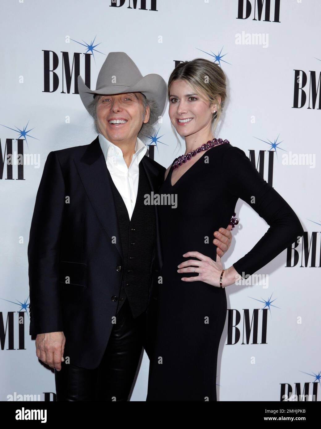Dwight Yoakam, left, and Emily Joyce arrive at 67th Annual BMI Country