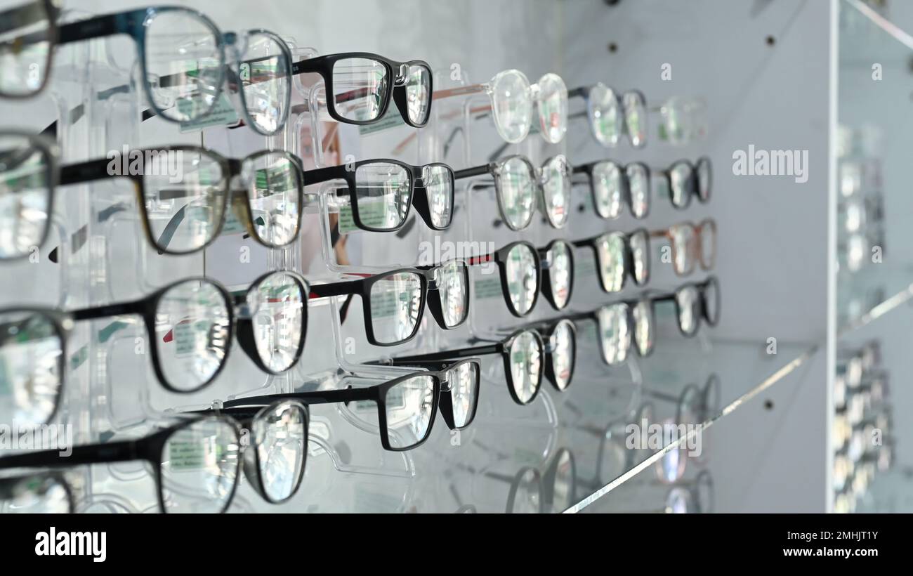 Image of spectacles on shelf in optical store. Optics, health care and