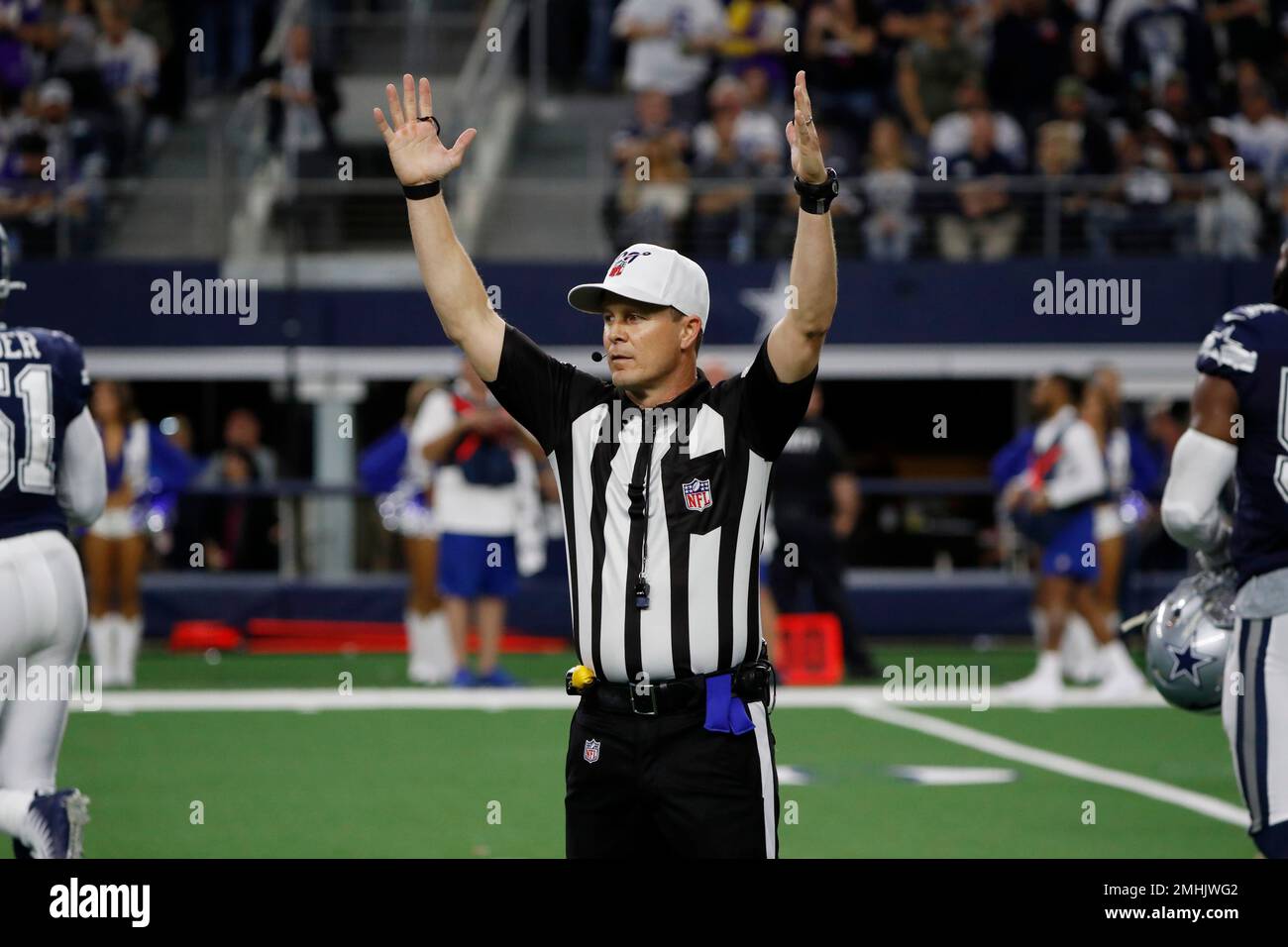NFL referee Shawn Hochuli signals touchdown during the second half of an  NFL football game between the Dallas Cowboys and Minnesota Vikings in  Arlington, Texas, Sunday, Nov. 10, 2019. Minnesota beat Dallas, image size:1300x956