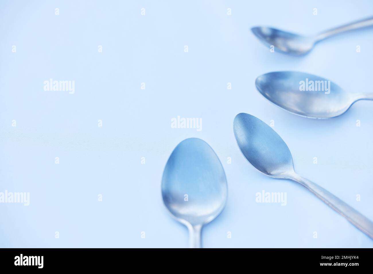 Kitchen, cutlery and spoon on a table as a group with mockup to represent community, charity or