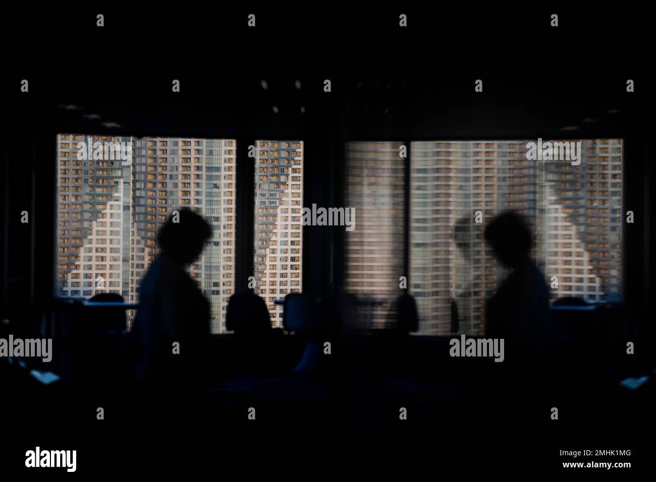 Curated visual reference: Picture Idea: A Tall Apartment Building Is Seen Through The Window Of